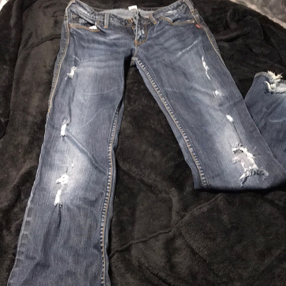 Ripped style low rise blue jeans